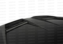 Load image into Gallery viewer, DV-style carbon fiber hood for 2010-2014 VW Golf / GTI (Shaved) - Seibon Carbon - HD1011VWGTIB-DV
